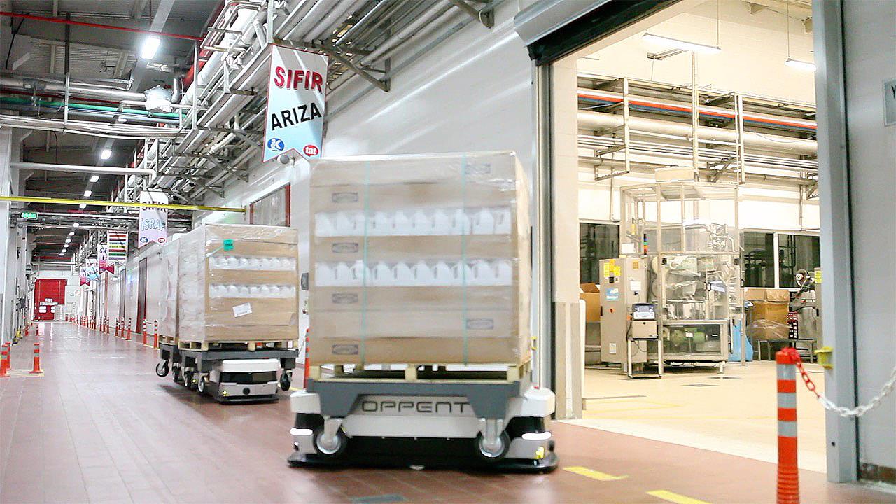 A fleet of Oppent EVO 2 AGVs at work in a warehouse
