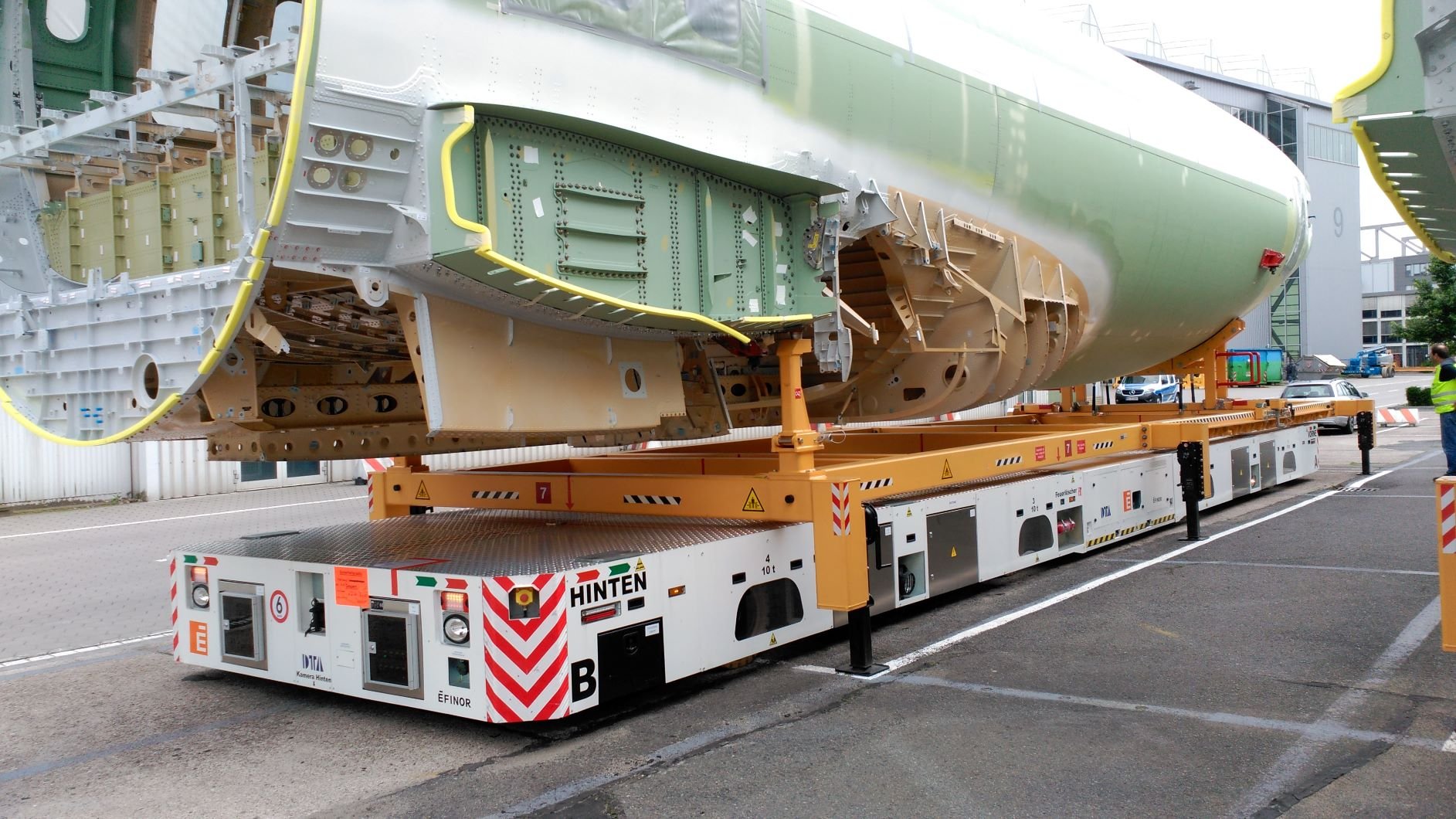 A heavy AGV, the DTA Dolphin, carrying part of an aircraft