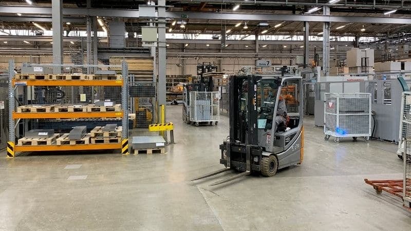 A manual forklift at work in a warehouse