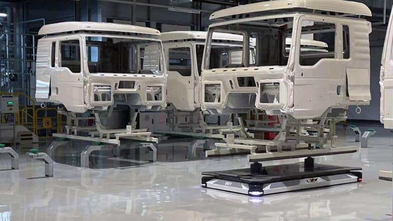 EcoProFleet Paint shop AGVs by Durr moving a truck cab.